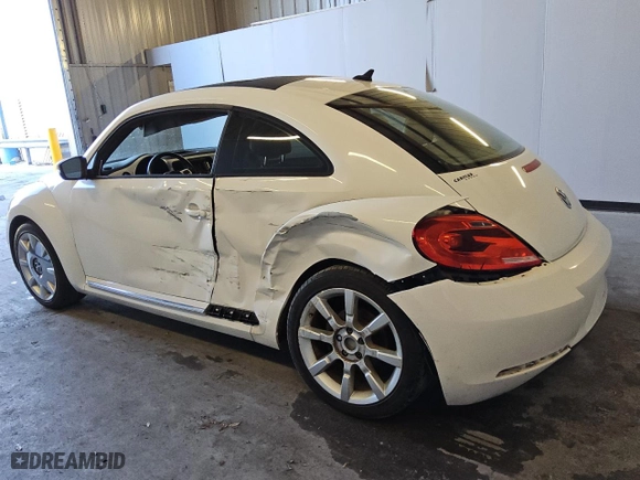 2012 Volkswagen Beetle 2.5L w/Sun/Sound/Nav PZEV with VIN 3VWHP7AT5CM638470, listed as a Copart auction lot 83471284 with 87,912 mi miles and Clean Title. Bid and sale history available at carsss.com. Image 2.