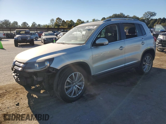 2014 Volkswagen Tiguan SE with VIN WVGAV3AX9EW611860, listed as a Copart auction lot 74431754 with 116,022 mi miles and Salvage title. Bid and sale history available at DreamBid. Image 1.