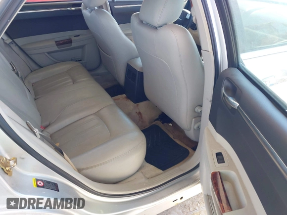 2005 Chrysler 300 with VIN 2C3AA63HX5H125777, listed as a IAAI auction lot 41843281 with 115,034 mi miles. Bid and sale history available at carsss.com. Image 8.