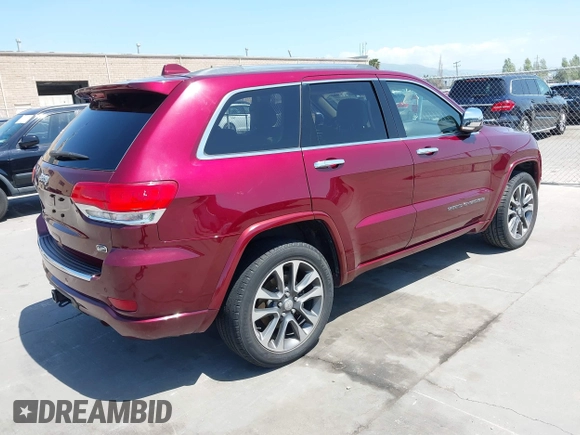2017 Jeep Grand Cherokee Overland with VIN 1C4RJFCTXHC676236, listed as a IAAI auction lot 42164645 with 94,658 mi miles and . Bid and sale history available at DreamBid. Image 4.