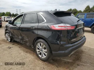 2019 Ford Edge Titanium with VIN 2FMPK4K93KBB42822, listed as a Copart auction lot 57308545 with 102,252 mi miles and Salvage title. Bid and sale history available at DreamBid. Image 2.