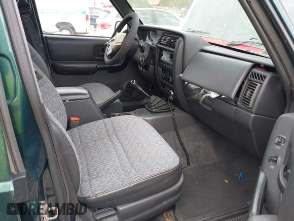 1999 Jeep Cherokee Sport with VIN 1J4FF68S1XL555463, listed as a IAAI auction lot 41898076 with 206,656 mi miles. Bid and sale history available at carsss.com. Image 5.