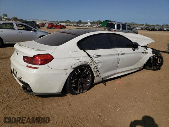 2015 BMW M6 z VIN WBS6C9C51FD467998, wystawiony jako Copart lot #67775934 z przebiegiem Nie podano mil oraz Szkody całkowita. Historia ofert i sprzedaży dostępna na DreamBid. Obrazek 3.