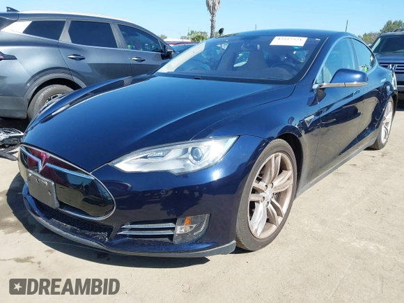 2013 Tesla Model S with VIN 5YJSA1CNXDFP28192, listed as a IAAI auction lot 42227521 with 60,967 mi miles and . Bid and sale history available at DreamBid. Image 2.