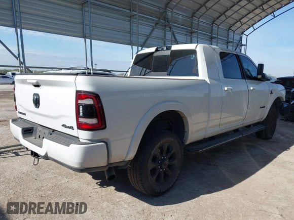 2021 Ram 2500 Laramie with VIN 3C6UR5NLXMG677847, listed as a IAAI auction lot 40992410 with 106,912 mi miles. Bid and sale history available at carsss.com. Image 4.