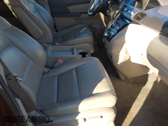 2012 Honda Odyssey Touring with VIN 5FNRL5H9XCB067841, listed as a IAAI auction lot 40631672 with 210,237 mi miles and . Bid and sale history available at DreamBid. Image 5.