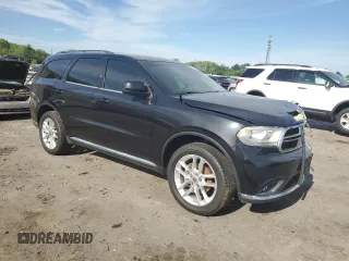 2016 Dodge Durango SXT with VIN 1C4RDJAG7GC408159, listed as a Copart auction lot 54196905 with 136,131 mi miles and Salvage title. Bid and sale history available at DreamBid. Image 4.