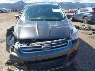 2016 Ford Escape Titanium with VIN 1FMCU9J96GUB96009, listed as a IAAI auction lot 41866127 with 132,990 mi miles and . Bid and sale history available at DreamBid. Image 13.