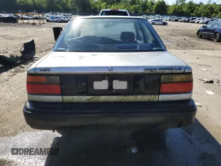 1990 Toyota Corolla z VIN JT2AE94A3L3318946, wystawiony jako Copart lot #59189514 z przebiegiem 115 252 mil mil oraz Czysty tytuł • Clean title. Historia ofert i sprzedaży dostępna na DreamBid. Obrazek 6.