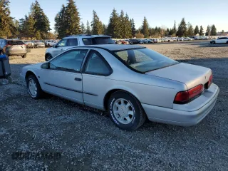 1995 Ford Thunderbird LX with VIN 1FALP62W5SH214974, listed as a Copart auction lot 42856995 with 150,454 mi miles and Clean Title. Bid and sale history available at DreamBid. Image 2.
