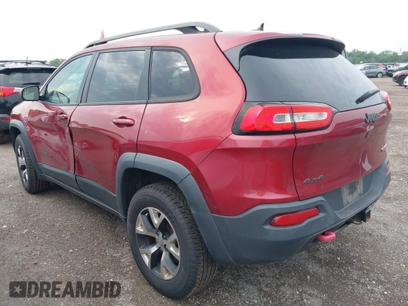 2015 Jeep Cherokee Trailhawk with VIN 1C4PJMBS6FW575517, listed as a IAAI auction lot 42661199 with 299,166 mi miles and . Bid and sale history available at DreamBid. Image 3.