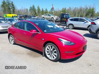 2018 Tesla Model 3 Long Range Battery z VIN 5YJ3E1EB3JF087779, wystawiony jako IAAI lot #42134749 z przebiegiem 21 529 mil mil oraz . Historia ofert i sprzedaży dostępna na DreamBid. Obrazek 1.