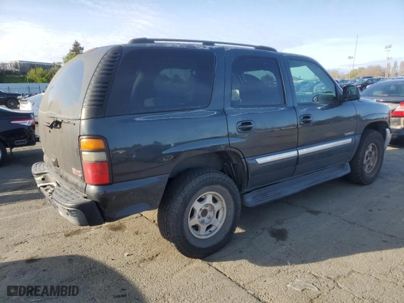 2005 GMC Yukon SLT with VIN 1GKEC13V95J163892, listed as a Copart auction lot 50243795 with 211,048 mi miles and Salvage Title. Bid and sale history available at carsss.com. Image 3.