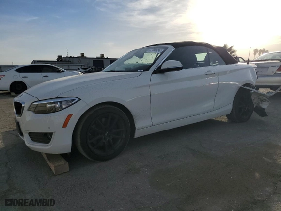 2015 BMW 2 Series 228i with VIN WBA1K5C57FV242909, listed as a Copart auction lot 77490994 with 55,099 mi miles and Salvage Title. Bid and sale history available at carsss.com. Image 1.