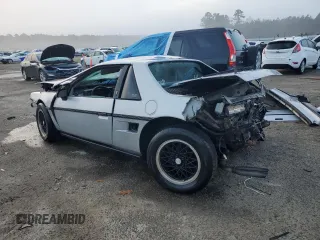 1985 Pontiac Fiero z VIN 1G2PF3795FP228812, wystawiony jako Copart lot #84717324 z przebiegiem 173 310 mil mil oraz Nie do naprawy • Non repairable. Historia ofert i sprzedaży dostępna na DreamBid. Obrazek 2.