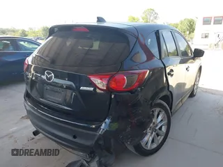2015 Mazda CX-5 Grand Touring with VIN JM3KE4DY7F0481883, listed as a IAAI auction lot 42091709 with 184,248 mi miles and . Bid and sale history available at DreamBid. Image 4.
