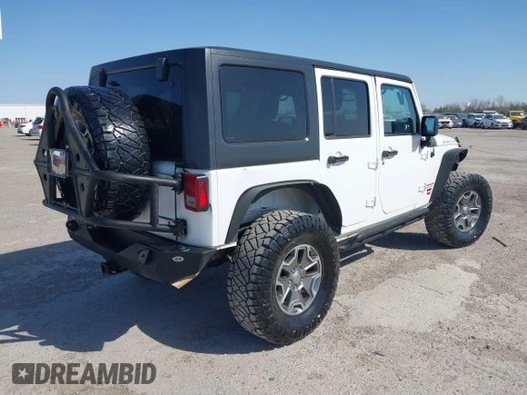2014 Jeep Wrangler Unlimited Rubicon with VIN 1C4BJWFG1EL167423, listed as a IAAI auction lot 41861109 with 104,669 mi miles. Bid and sale history available at carsss.com. Image 4.