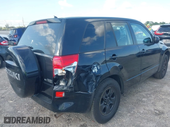 2008 Suzuki Grand Vitara with VIN JS3TE941284102380, listed as a IAAI auction lot 42061609 with 103,554 mi miles and . Bid and sale history available at DreamBid. Image 4.