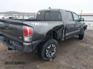 2022 Toyota Tacoma SR with VIN 3TMCZ5AN4NM476170, listed as a IAAI auction lot 41482149 with 57,126 mi miles and . Bid and sale history available at DreamBid. Image 6.