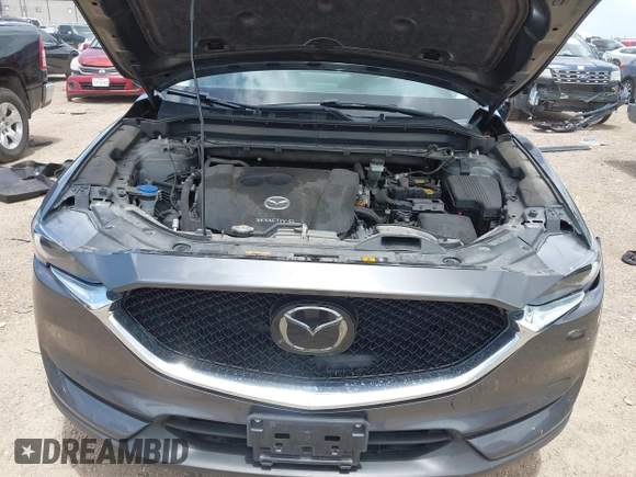 2021 Mazda CX-5 Grand Touring with VIN JM3KFBDM2M0431484, listed as a IAAI auction lot 42547665 with 34,757 mi miles and . Bid and sale history available at DreamBid. Image 10.