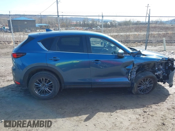 2021 Mazda CX-5 Touring with VIN JM3KFBCM4M0404093, listed as a IAAI auction lot 41751343 with 50,536 mi miles. Bid and sale history available at carsss.com. Image 13.