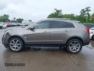 2012 Cadillac SRX Premium Collection z VIN 3GYFNCE3XCS620507, wystawiony jako IAAI lot #42348835 z przebiegiem 184 737 mil mil oraz . Historia ofert i sprzedaży dostępna na DreamBid. Obrazek 14.