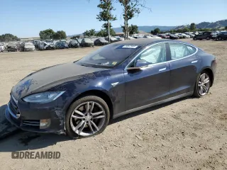 2013 Tesla Model S with VIN 5YJSA1AC9DFP10400, listed as a Copart auction lot 59047985 with 165,166 mi miles and Salvage title. Bid and sale history available at DreamBid. Image 1.