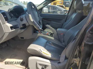 2005 Jeep Grand Cherokee Limited with VIN 1J8HR58265C699077, listed as a Copart auction lot 58490185 with 163,280 mi miles and Salvage title. Bid and sale history available at DreamBid. Image 7.