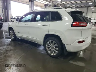 2016 Jeep Cherokee Overland with VIN 1C4PJLJB0GW302604, listed as a Copart auction lot 70624834 with 96,394 mi miles and Salvage title. Bid and sale history available at DreamBid. Image 2.