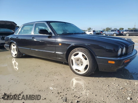 1997 Jaguar XJ with VIN SAJPX1149VC794067, listed as a Copart auction lot 85457044 with 139,764 mi miles and Clean title. Bid and sale history available at DreamBid. Image 4.