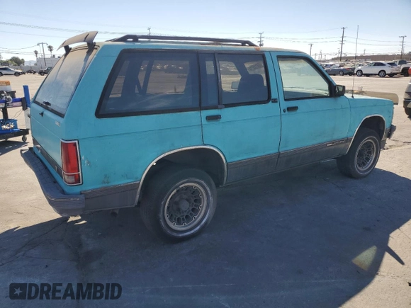 1991 GMC Jimmy z VIN 1GKCS13Z2M2518231, wystawiony jako Copart lot #64115274 z przebiegiem 132 698 mil mil oraz Czysty tytuł • Clean title. Historia ofert i sprzedaży dostępna na DreamBid. Obrazek 3.