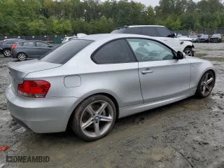 2011 BMW 1 Series 135i with VIN WBAUC9C56BVM09045, listed as a Copart auction lot 73316874 with 125,679 mi miles and Salvage Title. Bid and sale history available at carsss.com. Image 3.