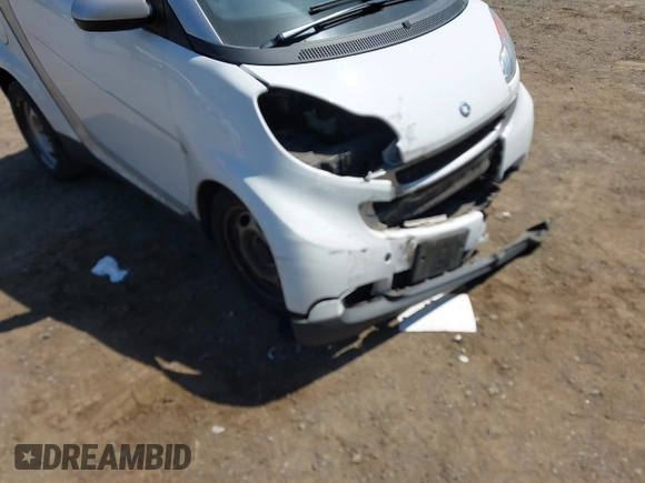 2012 Smart fortwo Pure z VIN WMEEJ3BAXCK563660, wystawiony jako IAAI lot #42165195 z przebiegiem 53 809 mil mil oraz . Historia ofert i sprzedaży dostępna na DreamBid. Obrazek 6.