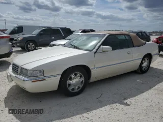 2002 Cadillac Eldorado z VIN 1G6EL12Y32B102263, wystawiony jako Copart lot #77108634 z przebiegiem 43 162 mil mil oraz Nie do naprawy • Non repairable. Historia ofert i sprzedaży dostępna na DreamBid. Obrazek 1.