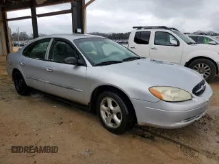2000 Ford Taurus SE with VIN 1FAFP532XYA141783, listed as a Copart auction lot 43949795 with 203,939 mi miles and Salvage Title. Bid and sale history available at DreamBid. Image 4.