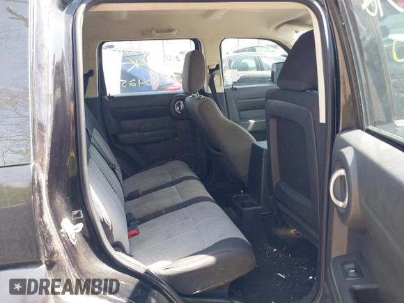 2009 Dodge Nitro SE z VIN 1D8GT28K69W505396, wystawiony jako IAAI lot #42104252 z przebiegiem 144 026 mil mil oraz . Historia ofert i sprzedaży dostępna na DreamBid. Obrazek 8.