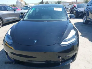 2021 Tesla Model 3 Long Range with VIN 5YJ3E1EB2MF065583, listed as a IAAI auction lot 42067399 with 52,333 mi miles. Bid and sale history available at carsss.com. Image 13.