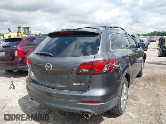 2015 Mazda CX-9 Touring with VIN JM3TB2CA7F0460232, listed as a IAAI auction lot 42344122 with 103,478 mi miles and . Bid and sale history available at DreamBid. Image 4.