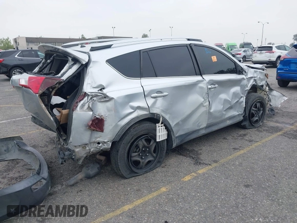 2014 Toyota RAV4 LE with VIN 2T3ZFREVXEW106571, listed as a IAAI auction lot 42161389 with Not provided miles and . Bid and sale history available at DreamBid. Image 4.