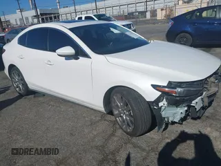2021 Mazda 3 Premium with VIN JM1BPADL4M1313602, listed as a IAAI auction lot 41337530 with 33,593 mi miles and . Bid and sale history available at DreamBid. Image 1.