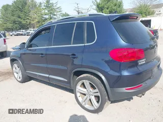 2014 Volkswagen Tiguan S z VIN WVGBV3AX7EW545538, wystawiony jako IAAI lot #42083281 z przebiegiem 129 227 mil mil oraz . Historia ofert i sprzedaży dostępna na DreamBid. Obrazek 3.