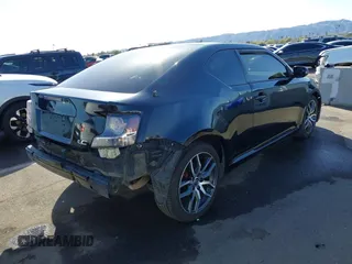 2015 Scion tC with VIN JTKJF5C79FJ003404, listed as a IAAI auction lot 41756024 with 128,906 mi miles. Bid and sale history available at carsss.com. Image 4.
