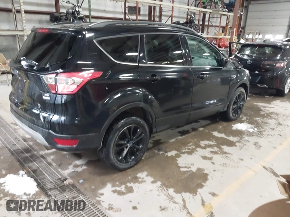 2018 Ford Escape SE with VIN 1FMCU9GD7JUD36295, listed as a IAAI auction lot 41855037 with 85,305 mi miles. Bid and sale history available at carsss.com. Image 4.