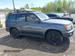 2003 Toyota Land Cruiser z VIN JTEHT05J932041288, wystawiony jako IAAI lot #42000615 z przebiegiem 166 159 mil mil oraz . Historia ofert i sprzedaży dostępna na DreamBid. Obrazek 13.