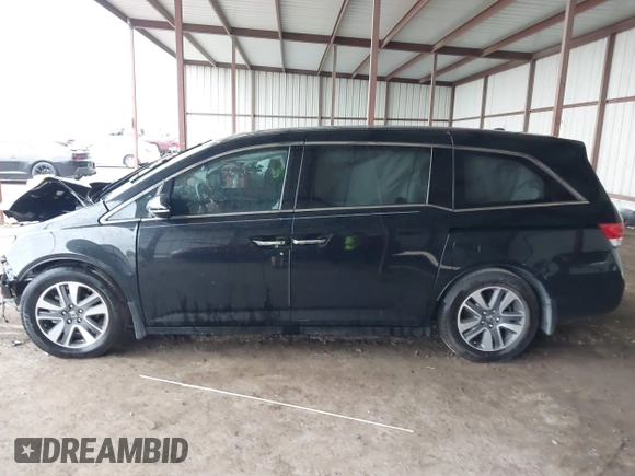 2014 Honda Odyssey Touring with VIN 5FNRL5H98EB095835, listed as a IAAI auction lot 42153412 with 124,131 mi miles and . Bid and sale history available at DreamBid. Image 15.