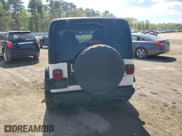 2003 Jeep Wrangler Rubicon z VIN 1J4FA69S73P333199, wystawiony jako Copart lot #50602615 z przebiegiem 133 254 mil mil oraz Szkoda całkowita • Salvage title. Historia ofert i sprzedaży dostępna na DreamBid. Obrazek 6.