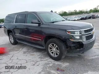2015 Chevrolet Suburban LT z VIN 1GNSCJKC5FR671673, wystawiony jako IAAI lot #42151006 z przebiegiem 163 772 mil mil oraz . Historia ofert i sprzedaży dostępna na DreamBid. Obrazek 1.