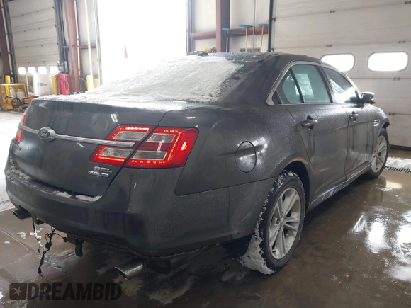 2015 Ford Taurus SEL with VIN 1FAHP2E89FG202589, listed as a IAAI auction lot 41592298 with 105,410 mi miles and . Bid and sale history available at carsss.com. Image 4.