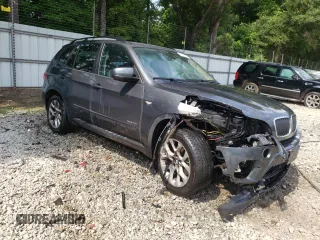 2012 BMW X5 35i z VIN 5UXZV4C55CL753810, wystawiony jako Copart lot #62405565 z przebiegiem 178 504 mil mil oraz Szkoda całkowita • Salvage title. Historia ofert i sprzedaży dostępna na DreamBid. Obrazek 4.
