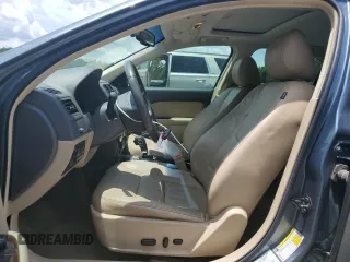 2012 Ford Fusion SEL with VIN 3FAHP0JG0CR222865, listed as a Copart auction lot 62716515 with 99,009 mi miles and Salvage title. Bid and sale history available at DreamBid. Image 7.